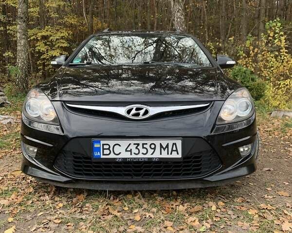 Черный Хендай i30, объемом двигателя 1.58 л и пробегом 235 тыс. км за 6700 $, фото 1 на Automoto.ua