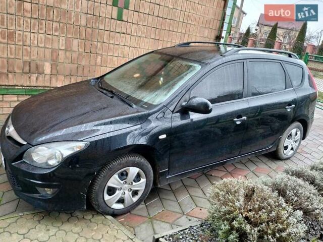 Черный Хендай i30, объемом двигателя 1.4 л и пробегом 157 тыс. км за 7100 $, фото 1 на Automoto.ua