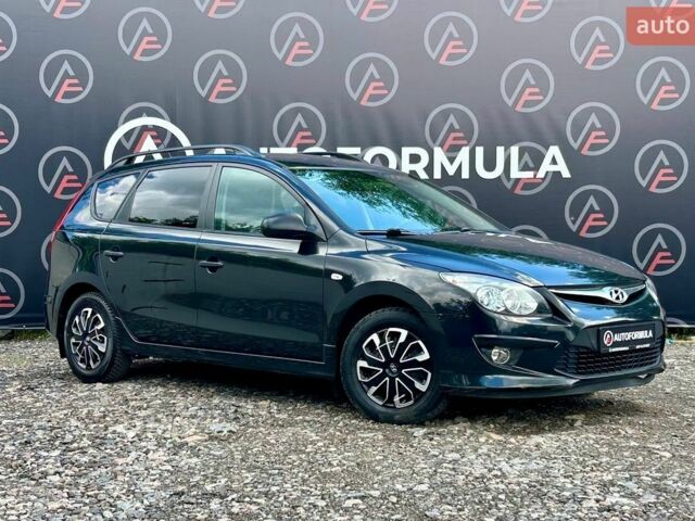 Черный Хендай i30, объемом двигателя 1.6 л и пробегом 245 тыс. км за 6490 $, фото 1 на Automoto.ua