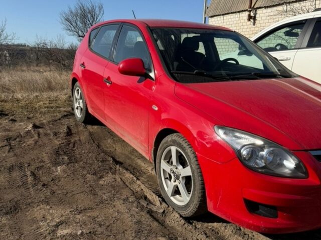 Червоний Хендай i30, об'ємом двигуна 1.4 л та пробігом 239 тис. км за 5300 $, фото 1 на Automoto.ua