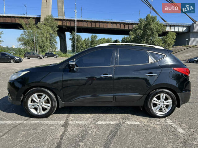 Чорний Хендай іх35, об'ємом двигуна 2 л та пробігом 196 тис. км за 12900 $, фото 1 на Automoto.ua