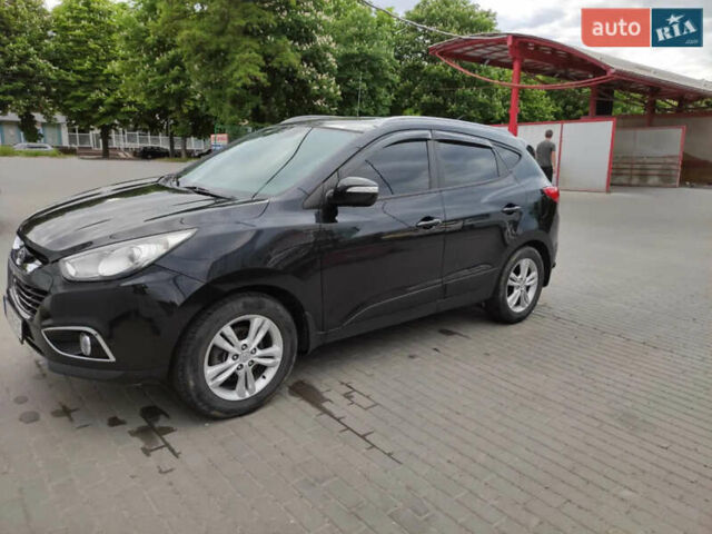 Черный Хендай их35, объемом двигателя 1.6 л и пробегом 295 тыс. км за 10500 $, фото 1 на Automoto.ua