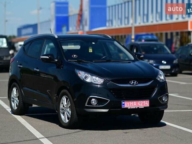 Чорний Хендай іх35, об'ємом двигуна 2 л та пробігом 226 тис. км за 10990 $, фото 1 на Automoto.ua