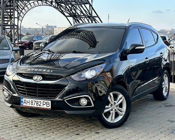 Чорний Хендай іх35, об'ємом двигуна 2 л та пробігом 241 тис. км за 14400 $, фото 1 на Automoto.ua