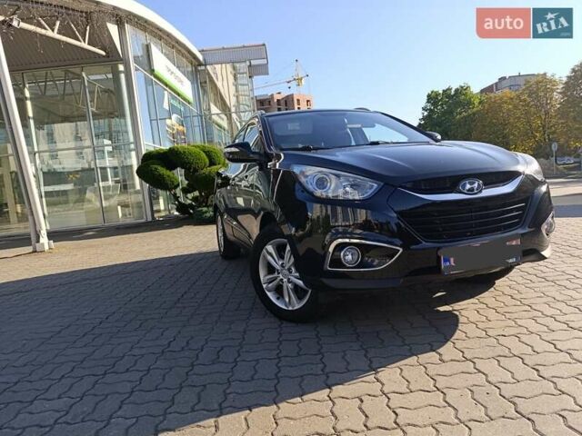 Чорний Хендай іх35, об'ємом двигуна 2 л та пробігом 237 тис. км за 12950 $, фото 1 на Automoto.ua