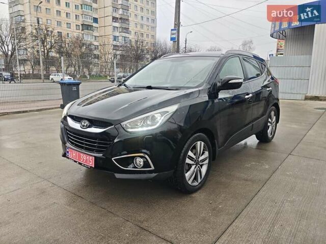 Чорний Хендай іх35, об'ємом двигуна 2 л та пробігом 203 тис. км за 13850 $, фото 1 на Automoto.ua