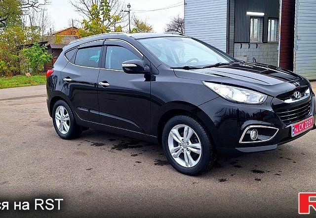 Чорний Хендай іх35, об'ємом двигуна 2 л та пробігом 169 тис. км за 14300 $, фото 1 на Automoto.ua