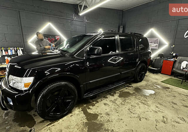Чорний Інфініті QX56, об'ємом двигуна 5.6 л та пробігом 320 тис. км за 12500 $, фото 1 на Automoto.ua