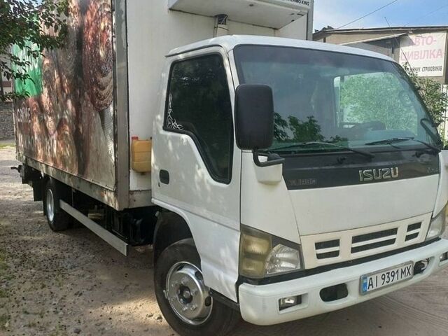 Белый Исузу НКР, объемом двигателя 4.57 л и пробегом 400 тыс. км за 12900 $, фото 1 на Automoto.ua