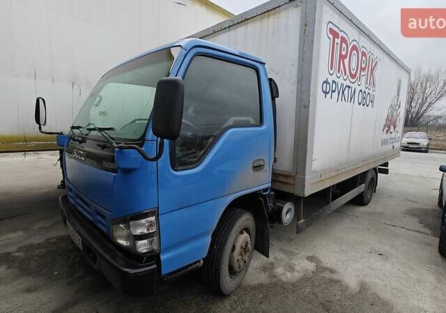 Синий Исузу НКР, объемом двигателя 5.2 л и пробегом 283 тыс. км за 10500 $, фото 1 на Automoto.ua