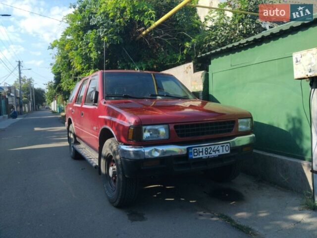 Красный Исузу Родео, объемом двигателя 2.6 л и пробегом 180 тыс. км за 2600 $, фото 1 на Automoto.ua
