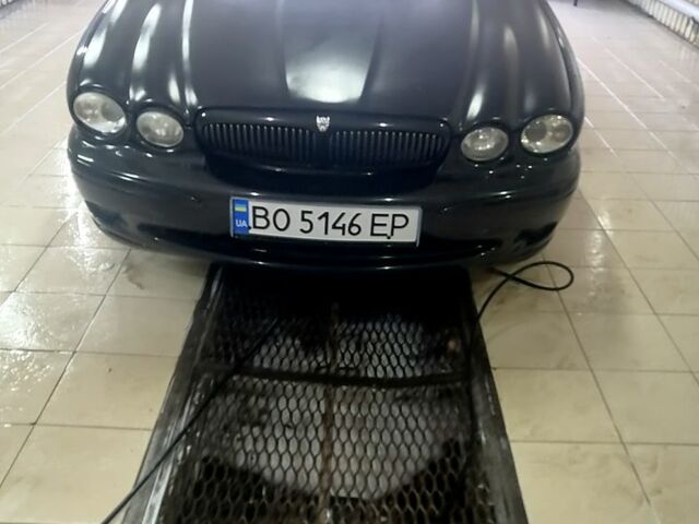 Черный Ягуар Х-Тайп, объемом двигателя 2.5 л и пробегом 280 тыс. км за 5450 $, фото 1 на Automoto.ua