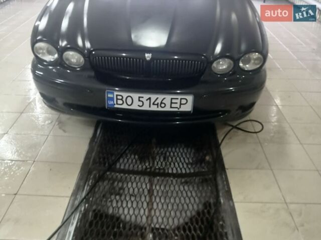 Черный Ягуар Х-Тайп, объемом двигателя 2.5 л и пробегом 250 тыс. км за 3850 $, фото 1 на Automoto.ua
