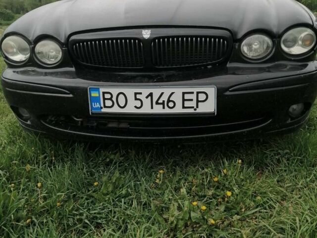 Черный Ягуар Х-Тайп, объемом двигателя 2.5 л и пробегом 300 тыс. км за 3850 $, фото 1 на Automoto.ua