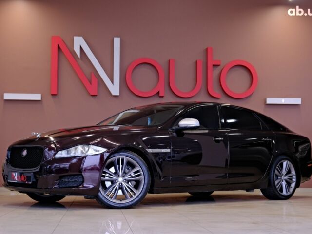 Красный Ягуар Икс Джей, объемом двигателя 5 л и пробегом 133 тыс. км за 13900 $, фото 1 на Automoto.ua