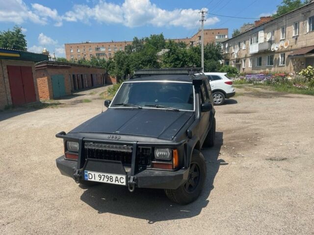 Чорний Джип Cherokee, об'ємом двигуна 4 л та пробігом 200 тис. км за 5504 $, фото 1 на Automoto.ua
