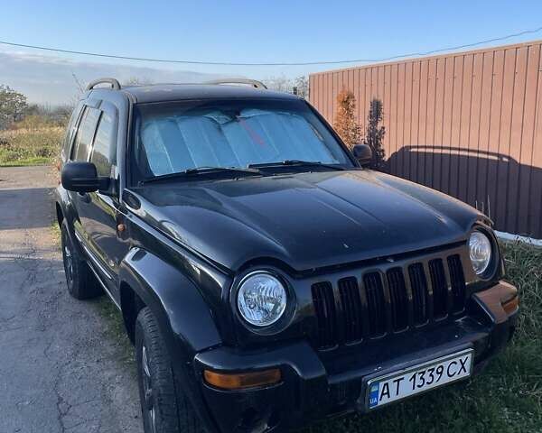 Черный Джип Чероки, объемом двигателя 3.7 л и пробегом 320 тыс. км за 6000 $, фото 1 на Automoto.ua
