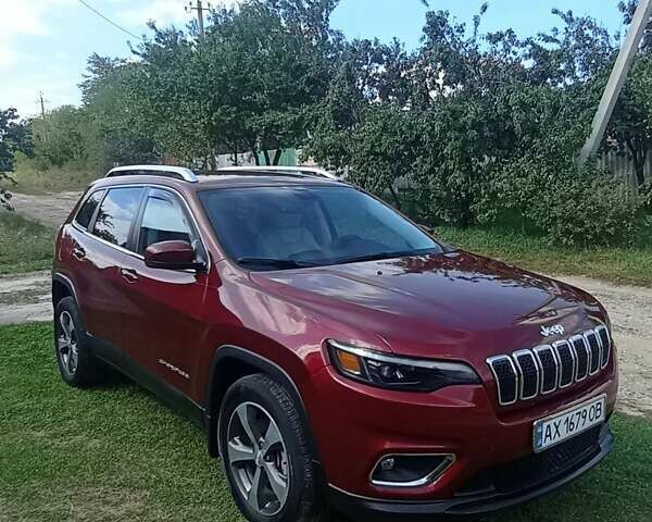 Красный Джип Чероки, объемом двигателя 3.24 л и пробегом 58 тыс. км за 20000 $, фото 1 на Automoto.ua