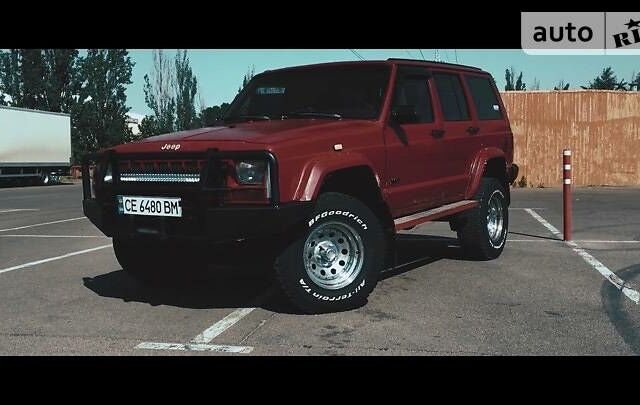 Червоний Джип Cherokee, об'ємом двигуна 4 л та пробігом 316 тис. км за 5500 $, фото 1 на Automoto.ua