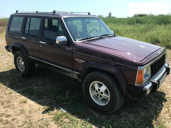 Червоний Джип Cherokee, об'ємом двигуна 4 л та пробігом 216 тис. км за 3200 $, фото 1 на Automoto.ua