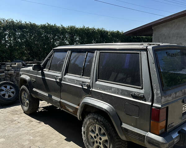 Сірий Джип Cherokee, об'ємом двигуна 4 л та пробігом 100 тис. км за 4250 $, фото 1 на Automoto.ua