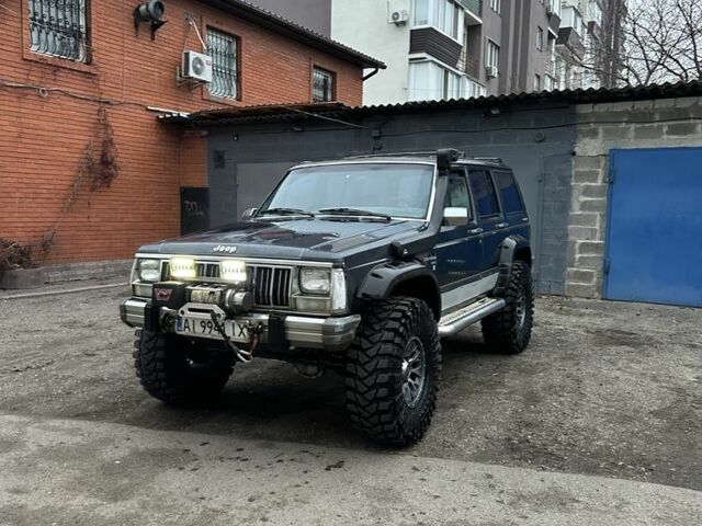 Синий Джип Чероки, объемом двигателя 3 л и пробегом 100 тыс. км за 7200 $, фото 1 на Automoto.ua