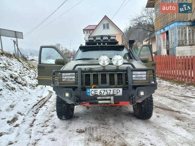 Зеленый Джип Чероки, объемом двигателя 4 л и пробегом 270 тыс. км за 7300 $, фото 1 на Automoto.ua