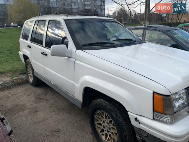 Білий Джип Grand Cherokee, об'ємом двигуна 5.2 л та пробігом 260 тис. км за 6500 $, фото 1 на Automoto.ua