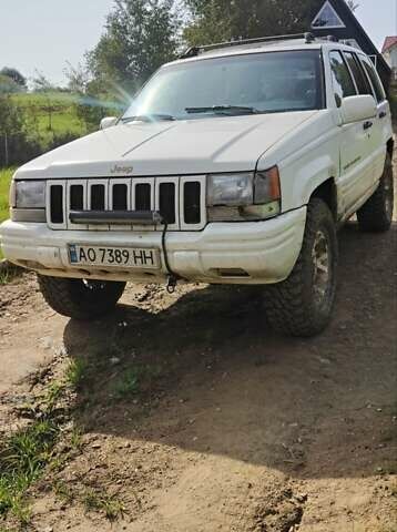 Білий Джип Grand Cherokee, об'ємом двигуна 5.2 л та пробігом 400 тис. км за 5500 $, фото 1 на Automoto.ua