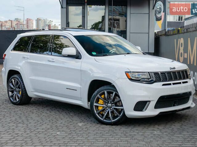 Білий Джип Grand Cherokee, об'ємом двигуна 6.2 л та пробігом 148 тис. км за 57700 $, фото 1 на Automoto.ua