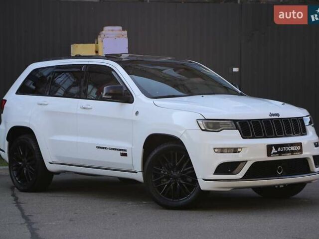 Белый Джип Гранд Чероки, объемом двигателя 5.65 л и пробегом 80 тыс. км за 35900 $, фото 1 на Automoto.ua