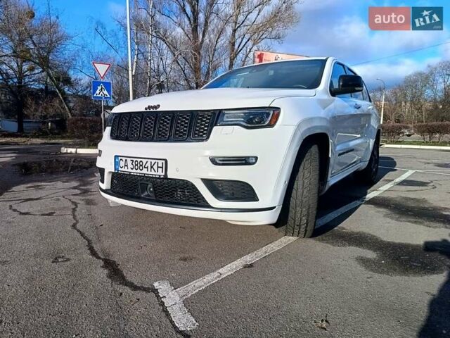 Белый Джип Гранд Чероки, объемом двигателя 5.65 л и пробегом 154 тыс. км за 28900 $, фото 1 на Automoto.ua