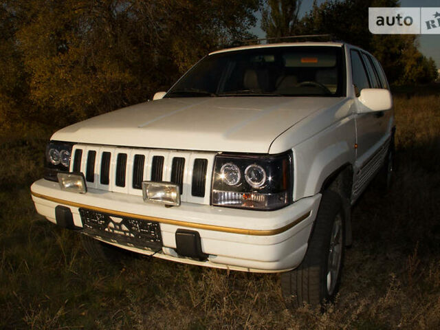 Білий Джип Grand Cherokee, об'ємом двигуна 4 л та пробігом 406 тис. км за 5000 $, фото 1 на Automoto.ua