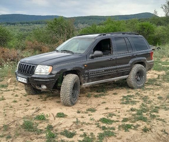 Чорний Джип Grand Cherokee, об'ємом двигуна 3.1 л та пробігом 332 тис. км за 8490 $, фото 1 на Automoto.ua