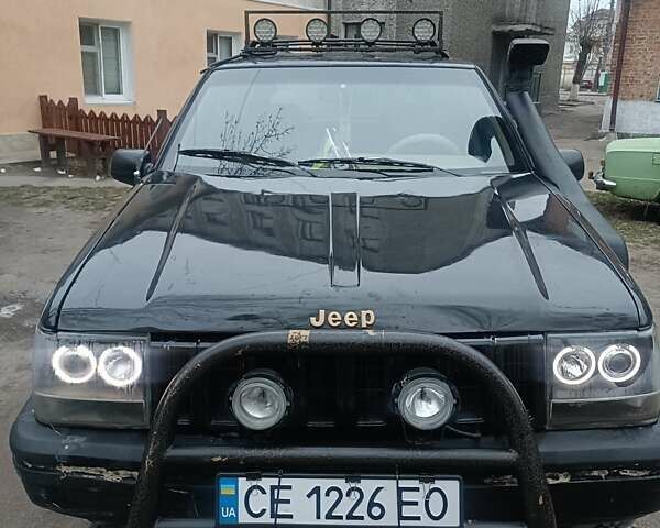 Черный Джип Гранд Чероки, объемом двигателя 5.2 л и пробегом 350 тыс. км за 5400 $, фото 1 на Automoto.ua