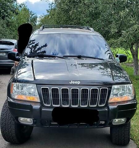 Чорний Джип Grand Cherokee, об'ємом двигуна 4 л та пробігом 379 тис. км за 8400 $, фото 1 на Automoto.ua