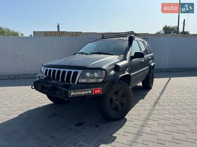 Чорний Джип Grand Cherokee, об'ємом двигуна 4.7 л та пробігом 220 тис. км за 9400 $, фото 1 на Automoto.ua