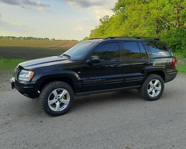 Черный Джип Гранд Чероки, объемом двигателя 2.69 л и пробегом 240 тыс. км за 9000 $, фото 1 на Automoto.ua