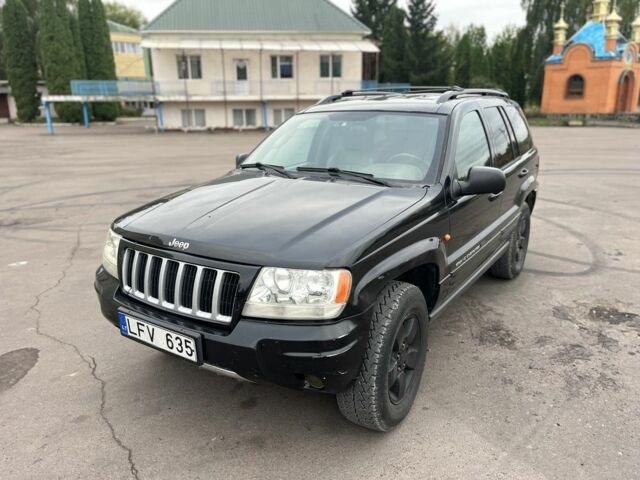 Черный Джип Гранд Чероки, объемом двигателя 2.7 л и пробегом 300 тыс. км за 4300 $, фото 1 на Automoto.ua