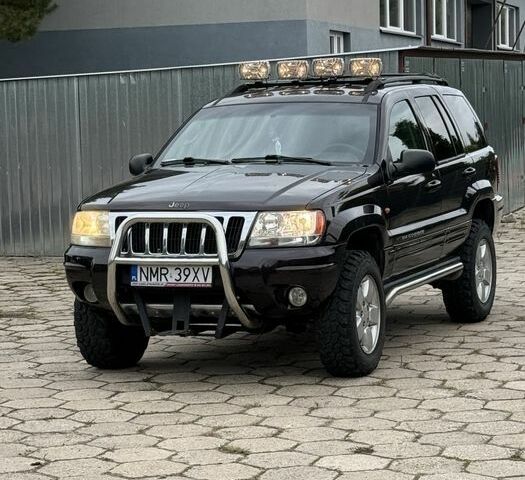 Черный Джип Гранд Чероки, объемом двигателя 2.7 л и пробегом 220 тыс. км за 2850 $, фото 1 на Automoto.ua