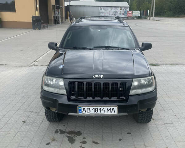 Чорний Джип Grand Cherokee, об'ємом двигуна 4 л та пробігом 125 тис. км за 7000 $, фото 1 на Automoto.ua