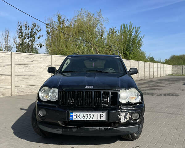 Черный Джип Гранд Чероки, объемом двигателя 3.7 л и пробегом 305 тыс. км за 11000 $, фото 1 на Automoto.ua