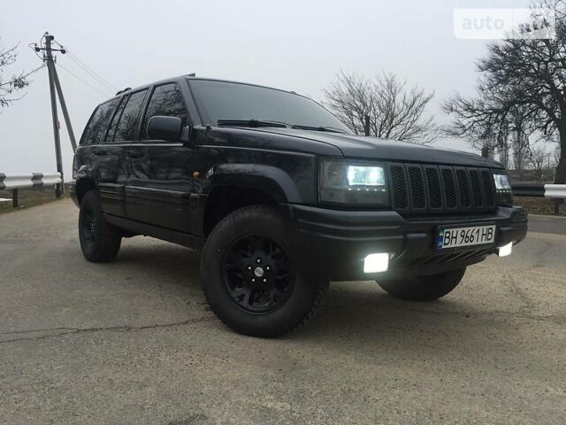 Чорний Джип Grand Cherokee, об'ємом двигуна 5.2 л та пробігом 200 тис. км за 6300 $, фото 1 на Automoto.ua