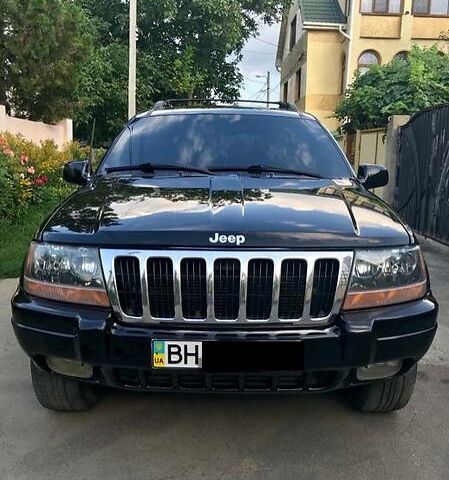 Чорний Джип Grand Cherokee, об'ємом двигуна 4 л та пробігом 217 тис. км за 9000 $, фото 1 на Automoto.ua