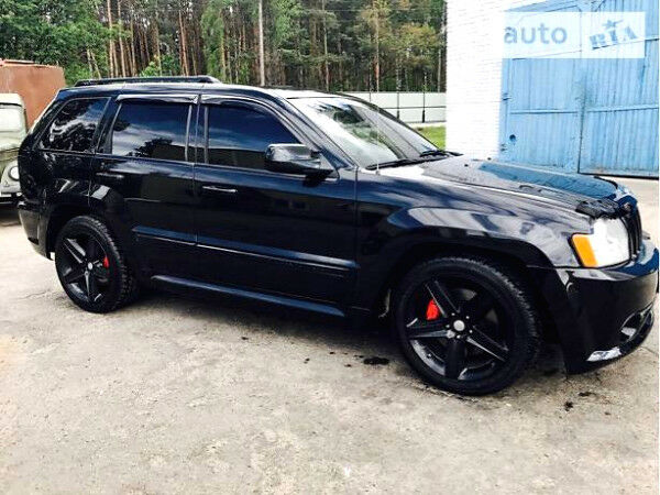 Чорний Джип Grand Cherokee, об'ємом двигуна 6.1 л та пробігом 137 тис. км за 25000 $, фото 1 на Automoto.ua