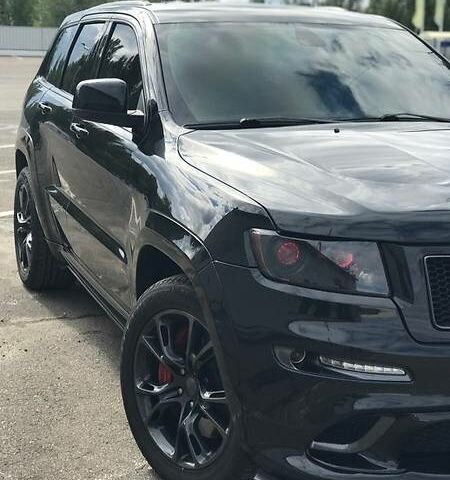 Чорний Джип Grand Cherokee, об'ємом двигуна 6.4 л та пробігом 84 тис. км за 54000 $, фото 1 на Automoto.ua