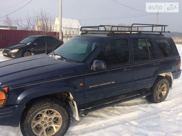 Фіолетовий Джип Grand Cherokee, об'ємом двигуна 5.2 л та пробігом 250 тис. км за 6700 $, фото 1 на Automoto.ua