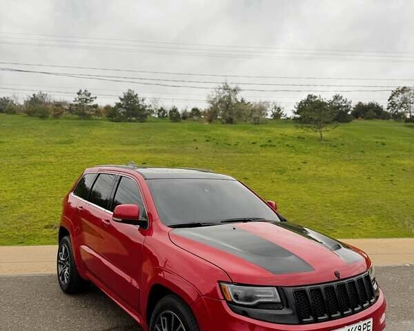 Красный Джип Гранд Чероки, объемом двигателя 6.4 л и пробегом 177 тыс. км за 31900 $, фото 1 на Automoto.ua