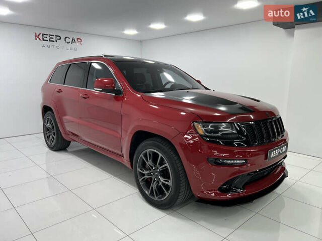 Красный Джип Гранд Чероки, объемом двигателя 6.42 л и пробегом 177 тыс. км за 33500 $, фото 1 на Automoto.ua
