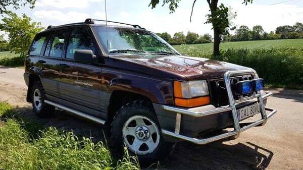 Червоний Джип Grand Cherokee, об'ємом двигуна 2.5 л та пробігом 250 тис. км за 2800 $, фото 1 на Automoto.ua